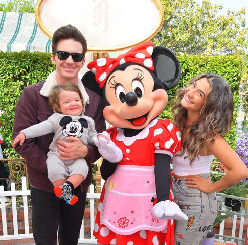 <p>Drake Bell Instagram</p> Drake Bell, Janet Von Schmeling and their son pose with Minnie Mouse.