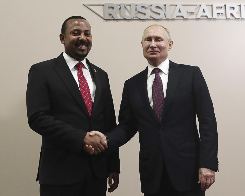 Russian President Vladimir Putin, right, and Ethiopian Prime Minister Abiy Ahmed pose for a photo prior to their talks on the sideline of Russia-Africa summit in the Black Sea resort of Sochi, Russia, Wednesday, Oct. 23, 2019. (Sergei Fadeyechev, TASS News Agency Pool Photo via AP)