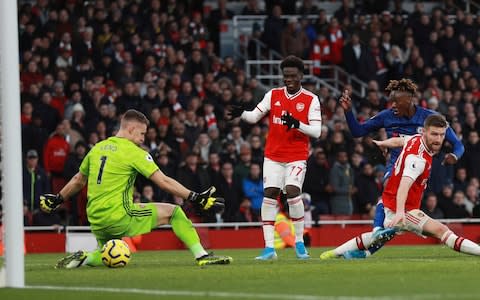 Tammy Abraham scores his side's second goal during the English Premier League soccer match between Arsenal and Chelsea - Credit: AP