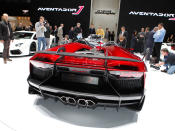 Starting with the everyday 700-hp Aventador, Lamborghini taunted the bull even further by removing the roof, adding several aerodynamic panels and generally shucking weight from a car that only had 3,472 lbs. to begin with. Even the seat fabrics have been swapped for something Lamborghini calls "Carbonskin," a fabric made from carbon fibers that's at least a decade away from being used on a teenager's hat. With no windshield, the interior has to get some form of waterproofing; the rear mirror pops up like Wall-E's head from the center of the dash. It and the roll bars behind the driver are the highest points in the car.