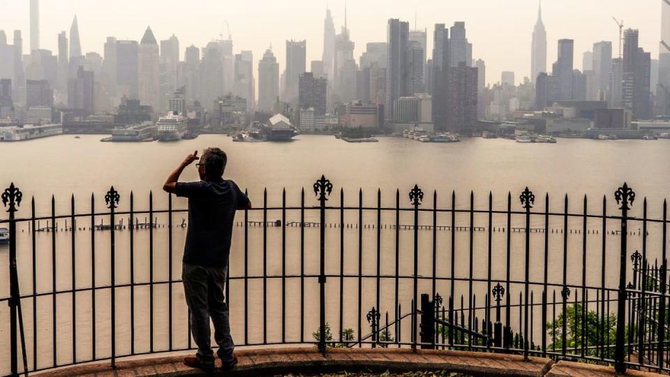 <div class="inline-image__caption"><p>A person looks out at the New York City skyline as its covered with haze and smoke from Canada wildfires on June 7, 2023 in Weehawken, New Jersey. Air pollution alerts were issued across the United States due to smoke from wildfires that have been burning in Canada for weeks.</p></div> <div class="inline-image__credit">Eduardo Munoz Alvarez / Getty</div>