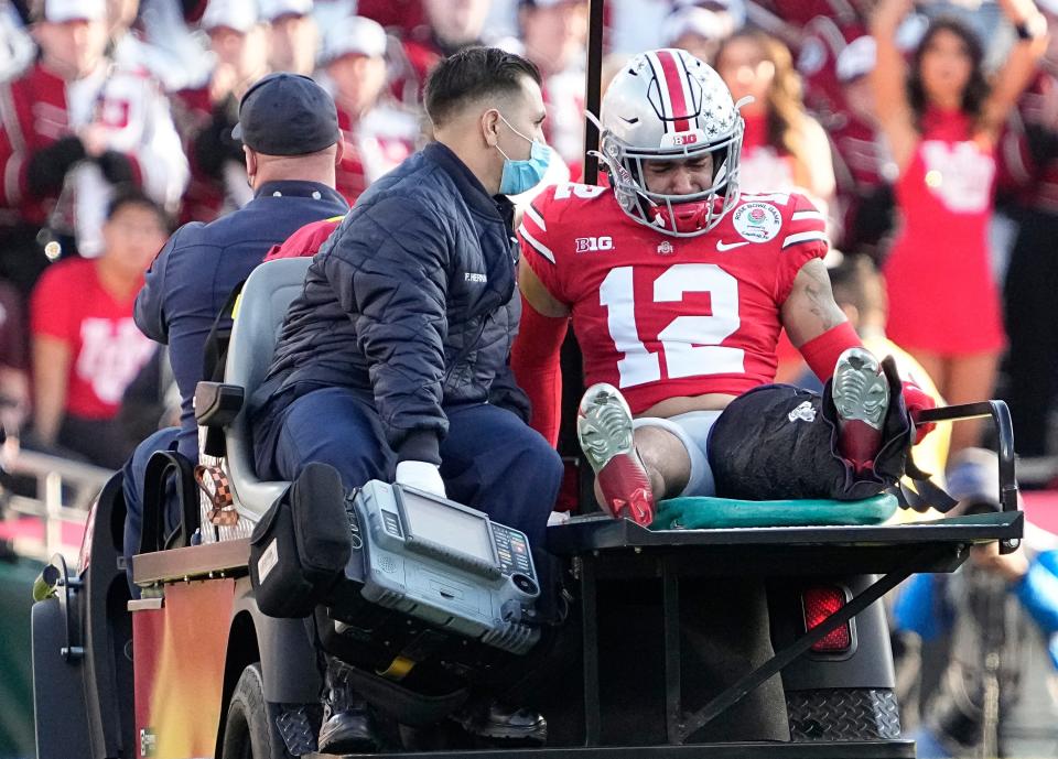 Ohio State Buckeyes safety Lathan Ransom (12) is carted off the field with an injury during the second quarter of the Rose Bowl in Pasadena, Calif. on Jan. 1, 2022.