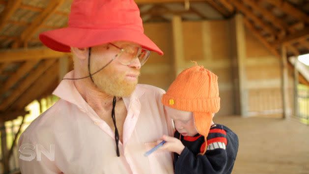 A man with his son at the Ukerewe Island refuge