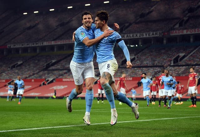 Stones (right) has formed a good partnership with Ruben Dias (left)