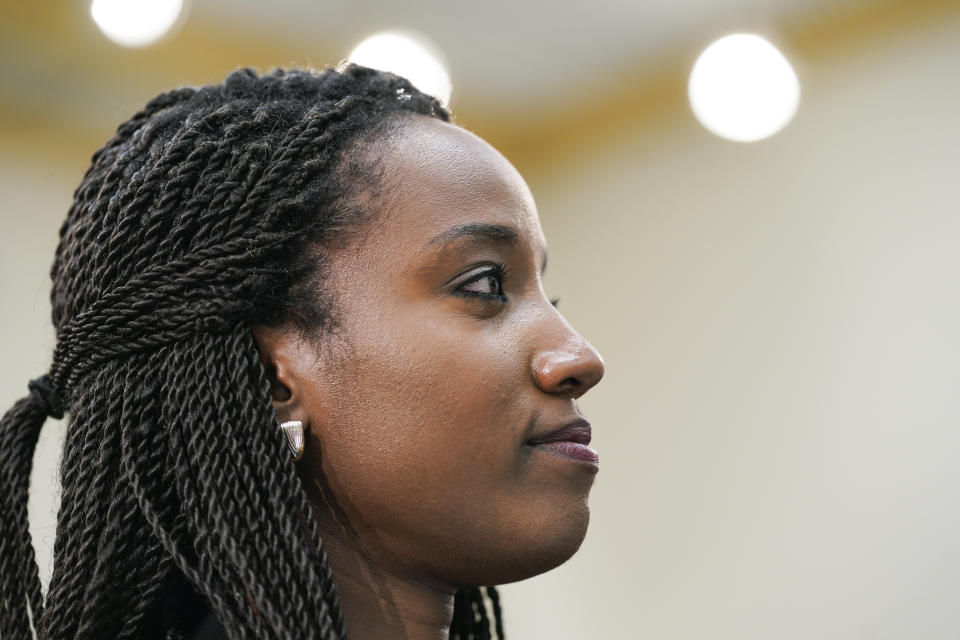 Carine Kanimba listens during a House Intelligence Committee hearing on Commercial Cyber Surveillance, Wednesday, July 27, 2022, on Capitol Hill in Washington. Kanimba and technology experts urged Congress to oppose the use of commercial spyware in the U.S. and discourage investment in spyware that has been used to hack the phones of dissidents, journalists, and even U.S. diplomats. (AP Photo/Mariam Zuhaib)