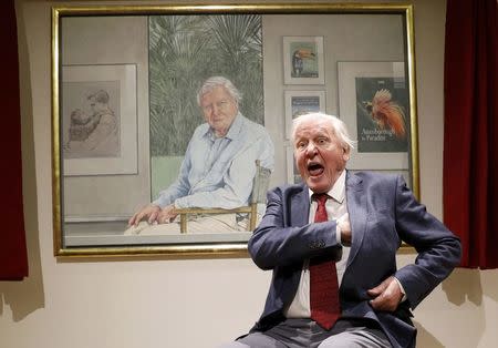 David Attenborough reacts next to a portrait of himself by Bryan Organ to mark his 90th birthday at New Walk Museum and Art Gallery in Leicester, Britain, September 22, 2016. REUTERS/Darren Staples