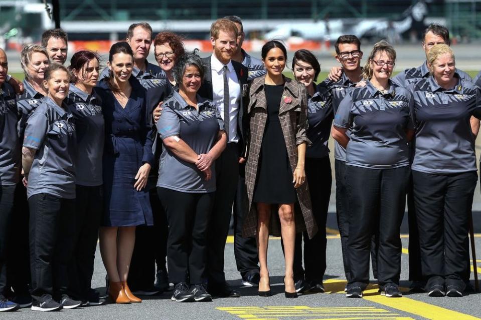 Prince Harry, Duke of Sussex, Meghan, Duchess of Sussex and Prime Minister Jacinda Ardern pose with Invictus Games athletes on arrival in New Zealand