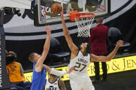 Utah Jazz center Rudy Gobert (27) blocks the shot from Dallas Mavericks forward Kristaps Porzingis, left, in the second half during an NBA basketball game Wednesday, Jan. 27, 2021, in Salt Lake City. (AP Photo/Rick Bowmer)