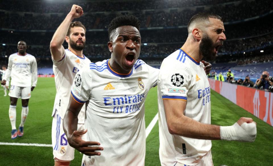 Real’s Karim Benzema (right) shows exactly what his winning penalty means (Getty)