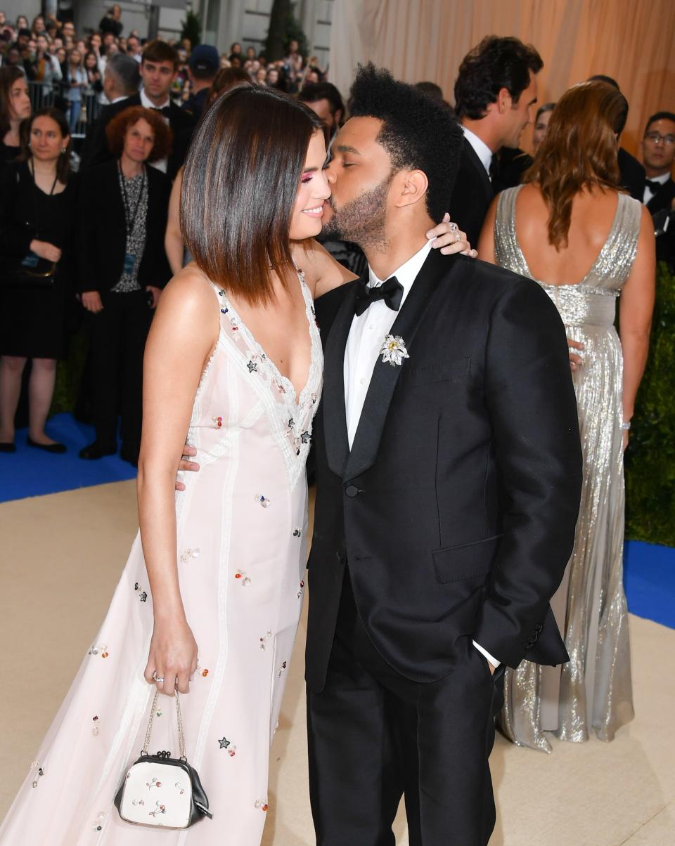 Selena Gomez and The Weekend made their relationship official at the 2017 Met Gala, posing for several adorable couple photos.