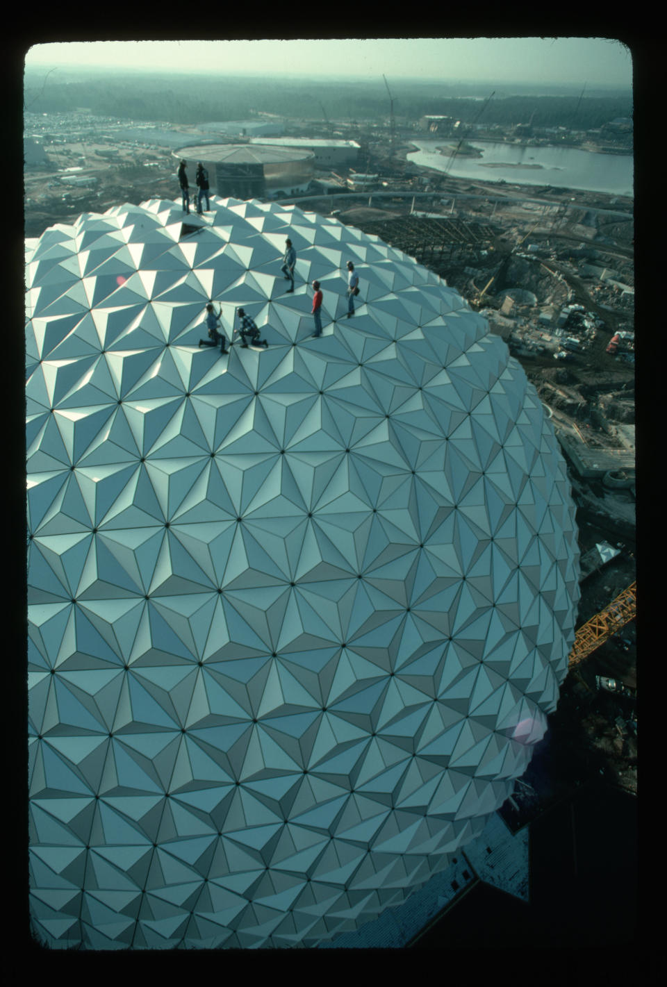 Workers complete the final stages of construction for Epcot's Spaceship Earth at Disney World. Epcot opened in 1982.