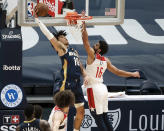 New Orleans Pelicans center Jaxson Hayes (10) dunks over Washington Wizards forward Anthony Gill (16) in the second quarter of an NBA basketball game in New Orleans, Wednesday, Jan. 27, 2021. (AP Photo/Derick Hingle)