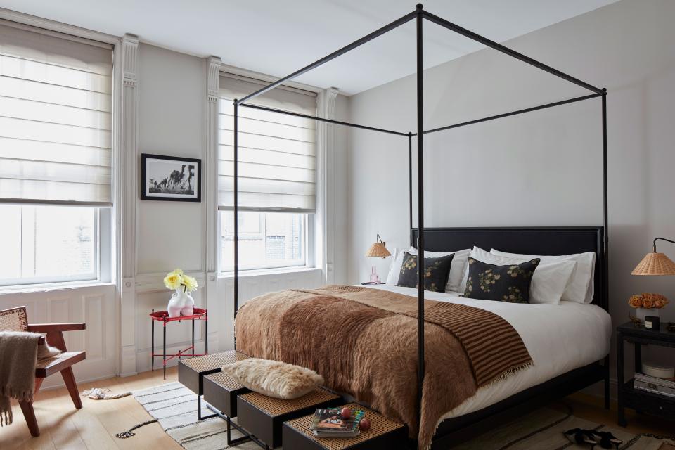 “Tali really pushed me to tone it down in here,” says Rubio. Roth recognized that this jet setter needed as much peaceful repose as possible, and so her bedroom reflects a Zen palette with ample texture thanks to Serena & Lily’s Flynn Wall Sconce Rattan and Resse Nighstands Cerused wood in ebony. A Jan Kath Moroccan kilim runs underneath an RH bed frame with a Gustavo Bittencourt bench at its foot and simple The Shade Store blinds to block out light.