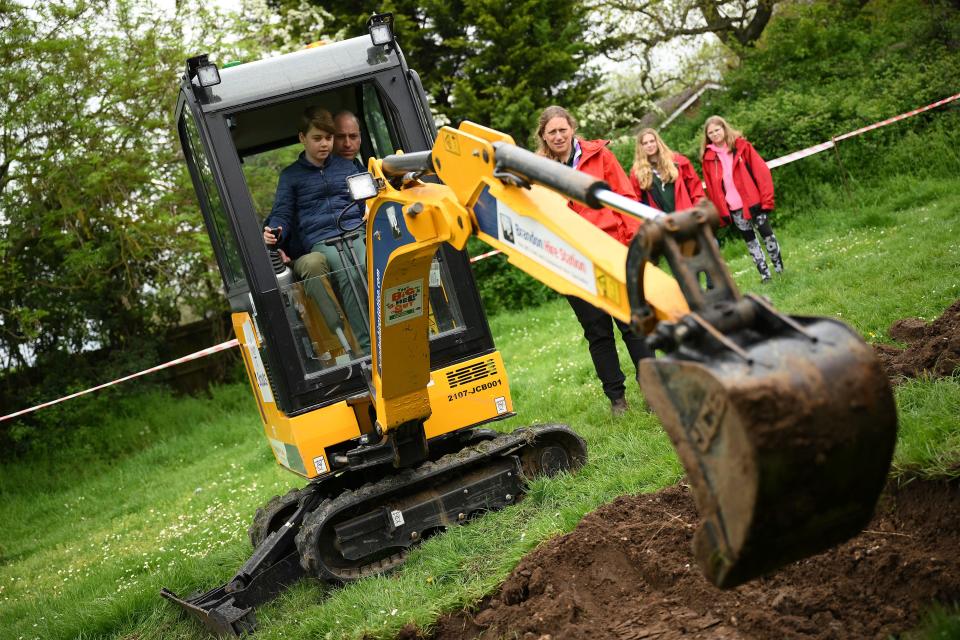 Prince George also got to ride on the excavator with his dad Prince William.