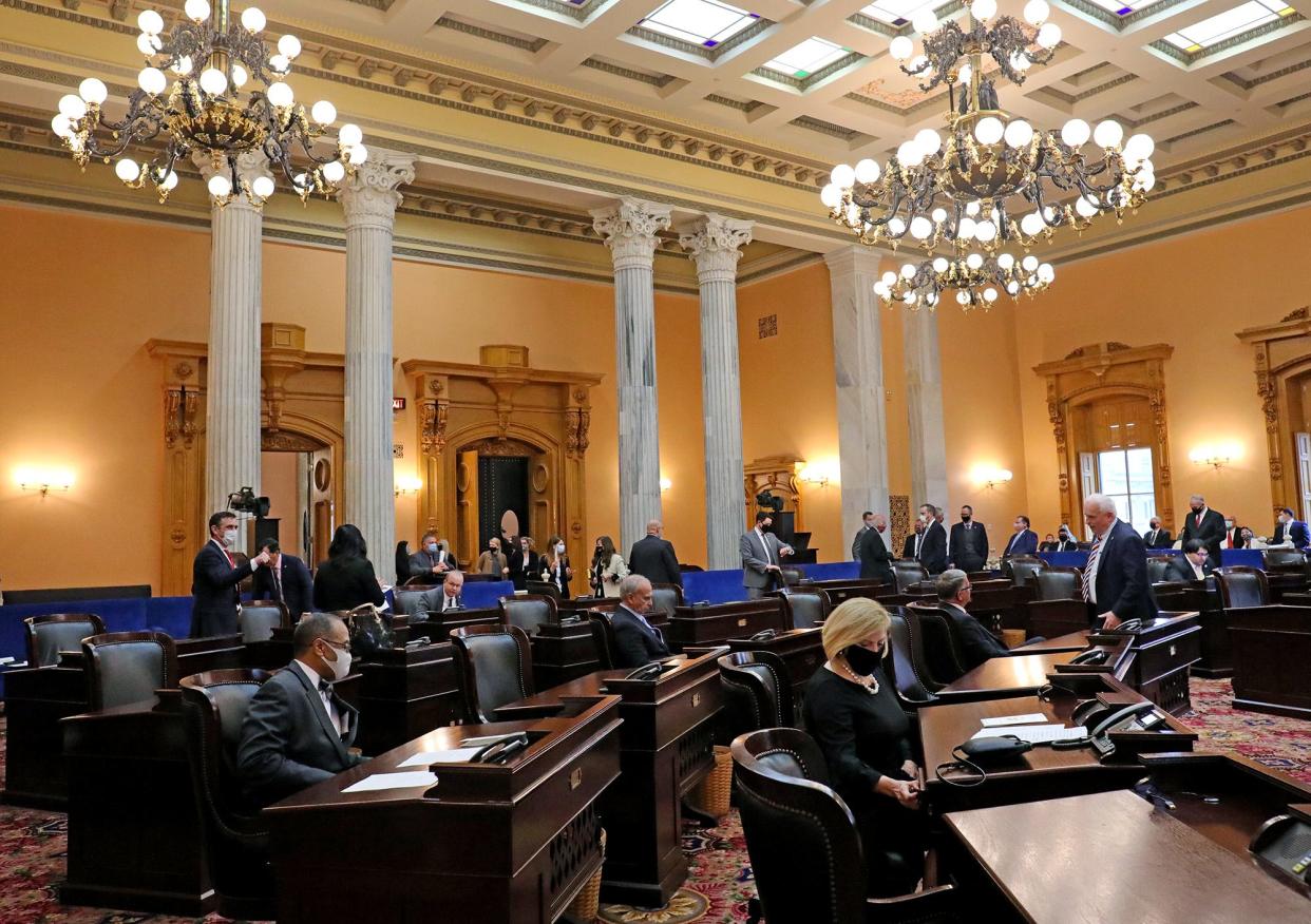 Members the of Ohio Senate take their seats at the start of a session in 2021.