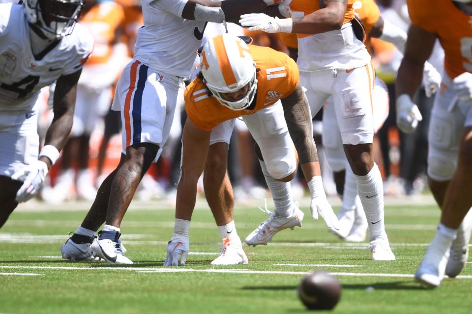 Tennessee linebacker Keenan Pili (11) scrambles for a ball that was later ruled not a fumble, during a game between Tennessee and Virginia in Nissan Stadium in Nashville, Tenn., Saturday, Sept. 2, 2023.