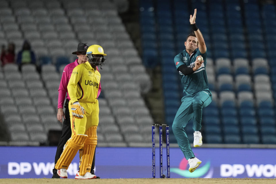 New Zealand's Tim Southee bowls as Uganda non-striking batsman Brian Masaba watches during an ICC Men's T20 World Cup cricket match at the Brian Lara Cricket Academy in Tarouba, Trinidad and Tobago, Friday, June 14, 2024. (AP Photo/Ramon Espinosa)