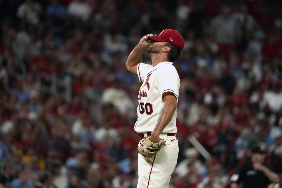 St. Louis Cardinals starting pitcher Adam Wainwright reacts after giving up a solo home run to Milwaukee Brewers' Luis Urias during the eighth inning of a baseball game Saturday, Aug. 13, 2022, in St. Louis. (AP Photo/Jeff Roberson)