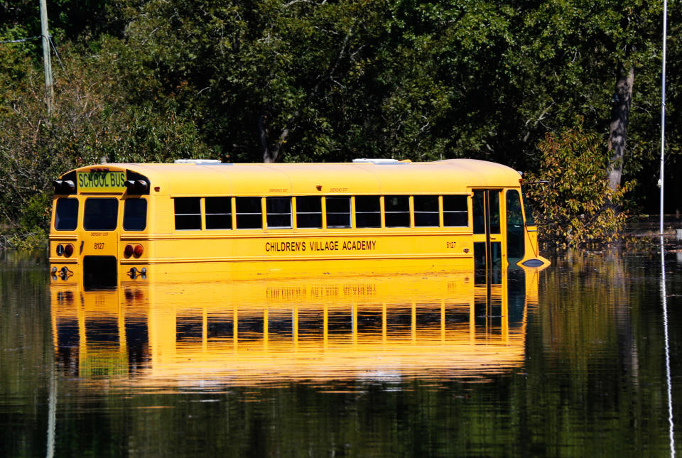 A school bus is partially submerged as the Neuse River floods following Hurricane Matthew in Kinston, North Carolina, Oct. 12, 2016. (Photo: Nicole Craine / Reuters)
