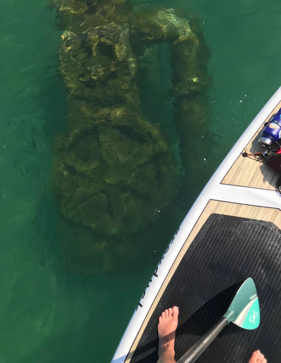 A standup paddler explores a shipwreck in the Wisconsin Shipwreck Coast National Marine Sanctuary off Point Beach Forest State Park. The sanctuary is one of 15 in the country, and the second in the Great Lakes.