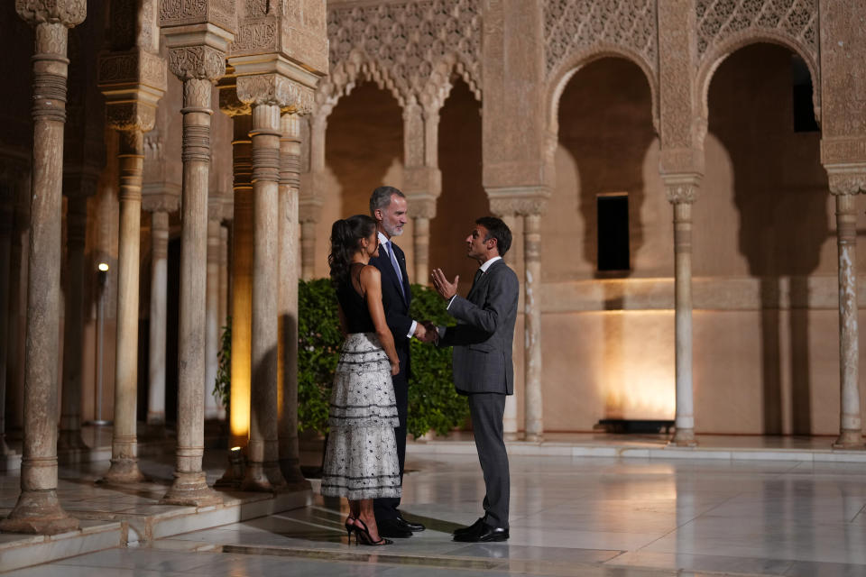 France's President Emmanuel Macron, right speaks with Spain's King Felipe VI and Queen Letizia at the Alhambra palace during the Europe Summit in Granada, Spain, Thursday, Oct. 5, 2023. Almost 50 European leaders are using a summit in southern Spain's Granada to stress they stand by Ukraine at a time when Western resolve appears somewhat weakened. Ukrainian President Volodymyr Zelenskyy retorted on Thursday that maintaining such unity was now "the main challenge."(AP Photo/Manu Fernandez)