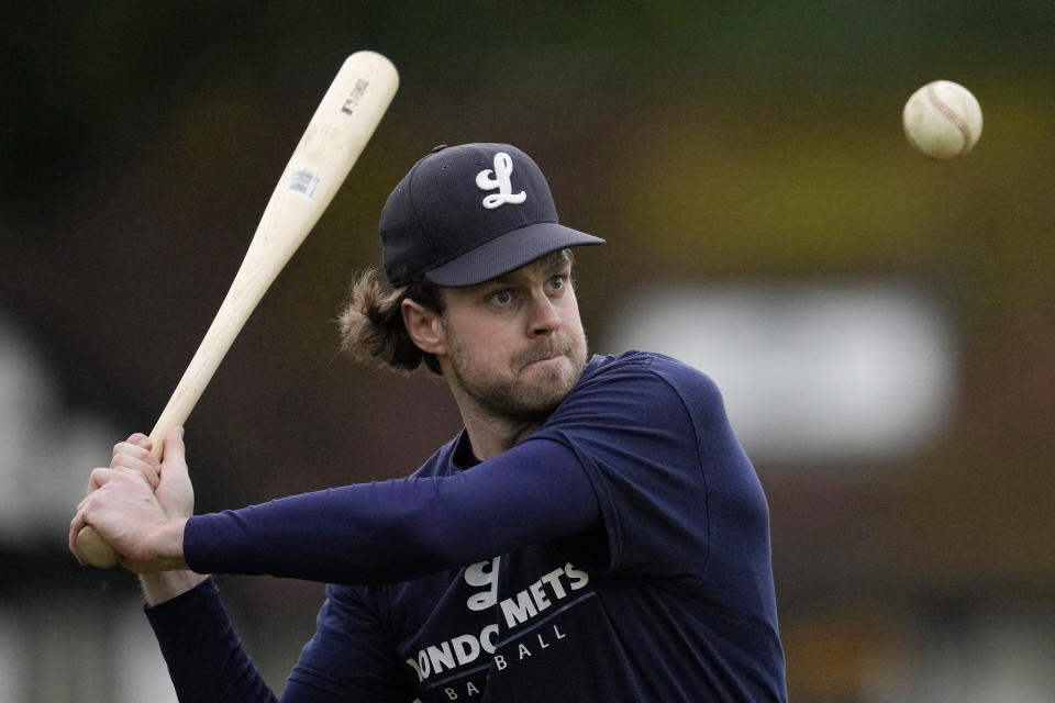 A member of the UK baseball team London Mets practices during a training session at the Finsbury Park in London, Thursday, May 16, 2024. Baseball at the highest club level in Britain is competitive. Teams are mélange of locals and expats some with college and minor league experience. (AP Photo/Kin Cheung)