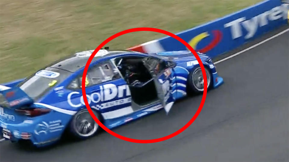 Macualey Jones is pictured driving with the door open on lap two of the Bathurst 1000.