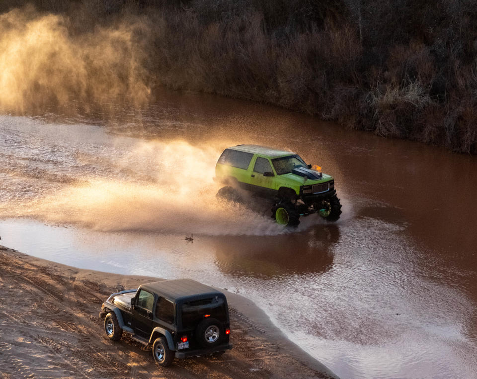 A jeep races through the water at the annual Sand Dregs event Saturday at the Canadian River north of Amarillo.