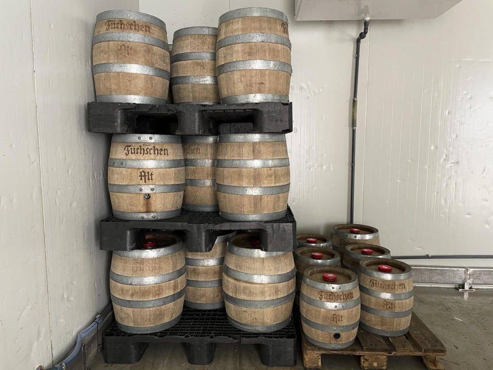 Beer barrels are stacked in the historic Fuechschen brewery in Duesseldorf, Germany, Tuesday, March 23, 2021, with about 6,000 litres of its renowned copper-colored 'Altbier' unsold and nearing its expiry date. The brewery now works with craft bakers who use the beer to make bread, with about twelve bakeries producing the grain bread and are giving the additional bonus of a bottle of Fuechschen's Altbier free of charge with every loaf. (AP Photo/Daniel Niemann)