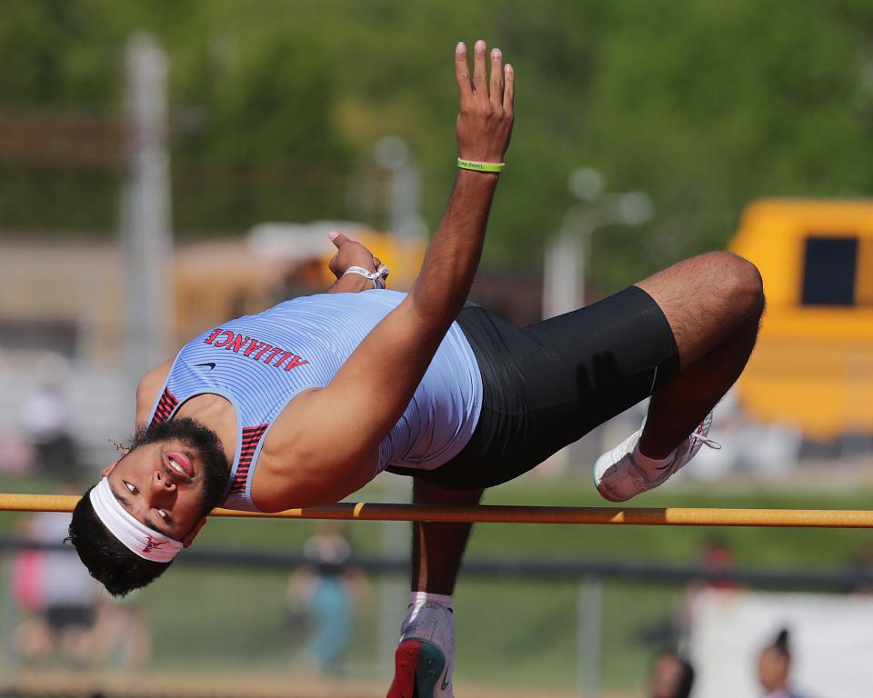 Alliance's Kayden Davis competes in the high jump during the EBC Championships at Marlington High School, Saturday, May 14, 2022.