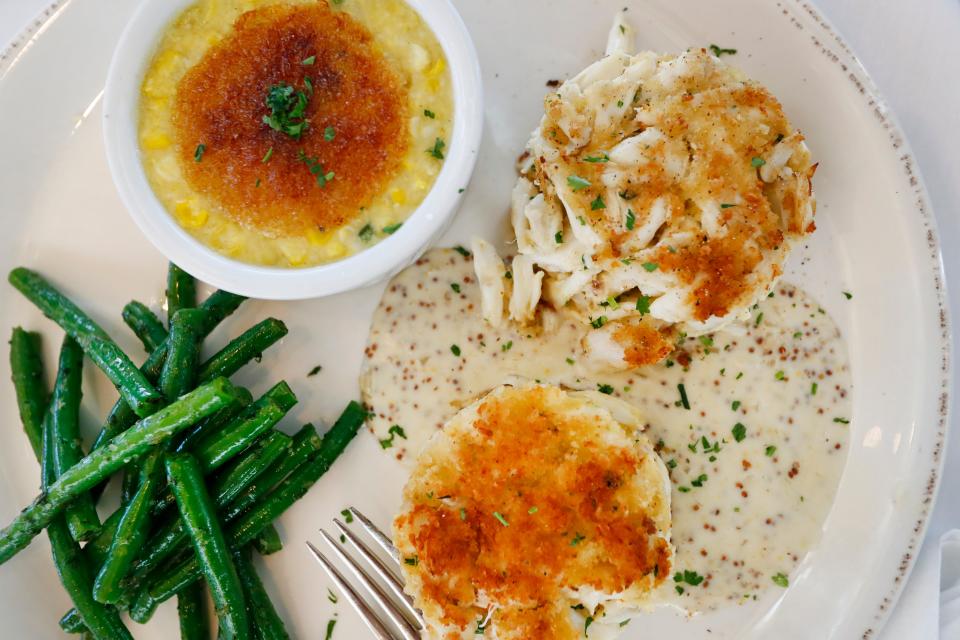 Crab cakes with sweet corn Brulee, green beens and jumbo lump crab at Coastal Fish Company at Shelby Farms Park.