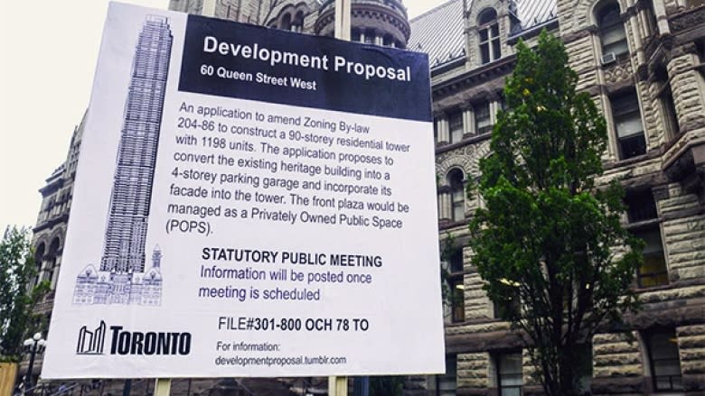 Condos in the CN Tower? Why artists are trolling Toronto with fake development proposal signs