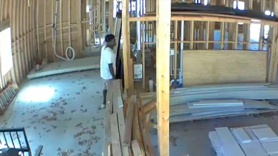 Ahmaud Arbery is seen in security camera footage on February 23, 2020. The video shows Arbery stopped for a few minutes inside a house under construction before resuming his jog that day. / Credit: Larry English