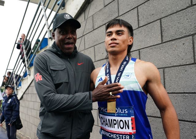 Louie Hinchliffe with his coach Carl Lewis after winning the 100m