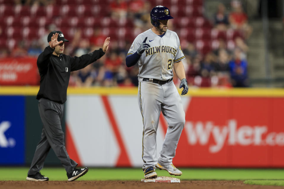 Milwaukee Brewers' Travis Shaw stands on second base after hitting a two-run double during the ninth inning of tgeh team's baseball game against the Cincinnati Reds in Cincinnati, Tuesday, June 8, 2021. The Brewers won 5-1. (AP Photo/Aaron Doster)