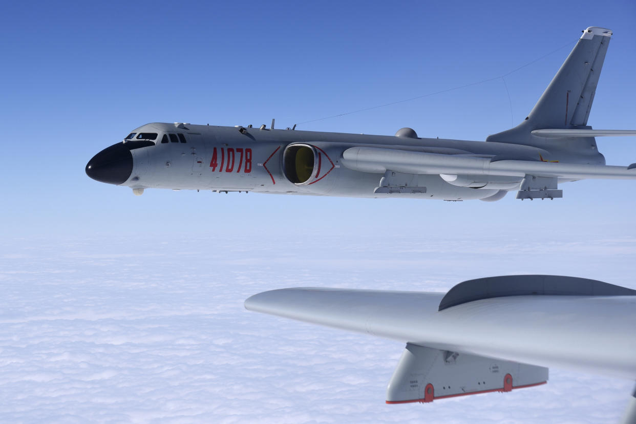 In this Nov. 23, 2017, photo released by Xinhua News Agency, a Chinese military H-6K bomber is seen conducting training exercises, as the People's Liberation Army (PLA) air force conducted a combat air patrol in the South China Sea. With record numbers of military flights near Taiwan over the last week, China has been stepping up its harassment of the island it claims as its own, showing an new intensity and sophistication as it asserts its territorial claims in the region. (Wang Guosong/Xinhua via AP)