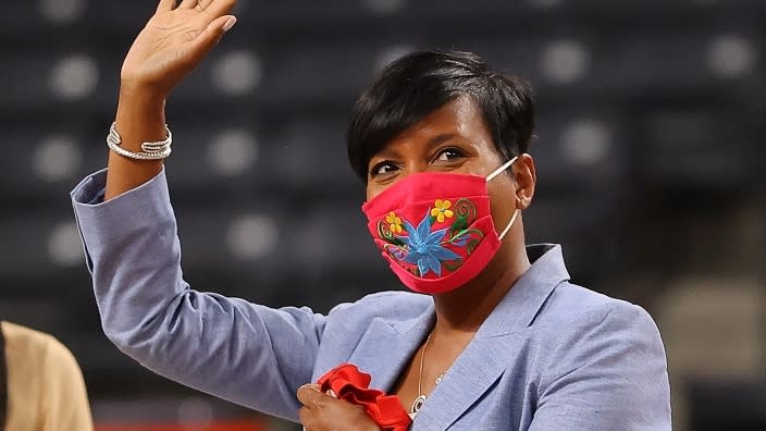 Atlanta Mayor Keisha Lance Bottoms accepts a personalized Atlanta Dream jersey during halftime of the game against the Phoenix Mercury at Gateway Center Arena last month. (Photo: Kevin C. Cox/Getty Images)