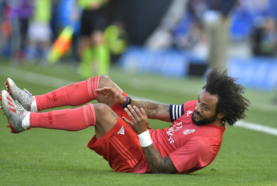 Real Madrid's Marcelo Vieira lies on the pitch during the Spanish La Liga soccer match between Real Sociedad and Real Madrid, at Anoeta stadium, in San Sebastian, northern Spain, Sunday, May 12, 2019. (AP Photo/Alvaro Barrientos)