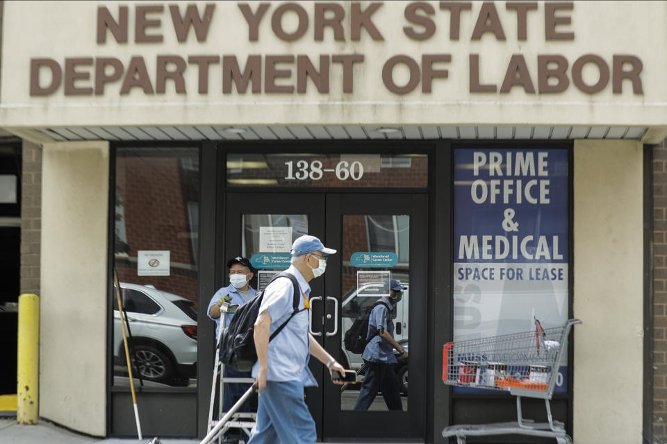 Pedestrians pass an office location for the New York State Department of Labor Thursday, June 11, 2020, in the Queens borough of New York. About 1.5 million laid-off workers applied for U.S. unemployment benefits last week, evidence that many Americans are still losing their jobs even as the economy appears to be slowly recovering with more businesses partially reopening. The latest figure from the Labor Department marked the 10th straight weekly decline in applications for jobless aid since they peaked in mid-March when the coronavirus hit hard. Still, the pace of layoffs remains historically high.  (AP Photo/Frank Franklin II)