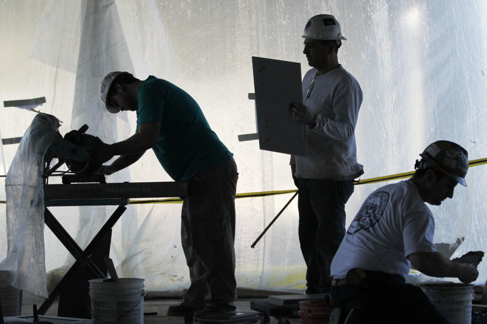 FILE - In this Feb. 28, 2012 file photo, workmen prepare the Valley Forge Casino Resort for its upcoming opening, in Valley Forge, Pa. The Commerce Department reported on Thursday, June 28, 2012, that the U.S. economy expanded at a 1.9 percent annual rate in the first three months of the year, a weak pace that few economists see changing much this year. (AP Photo/Matt Rourke, File)