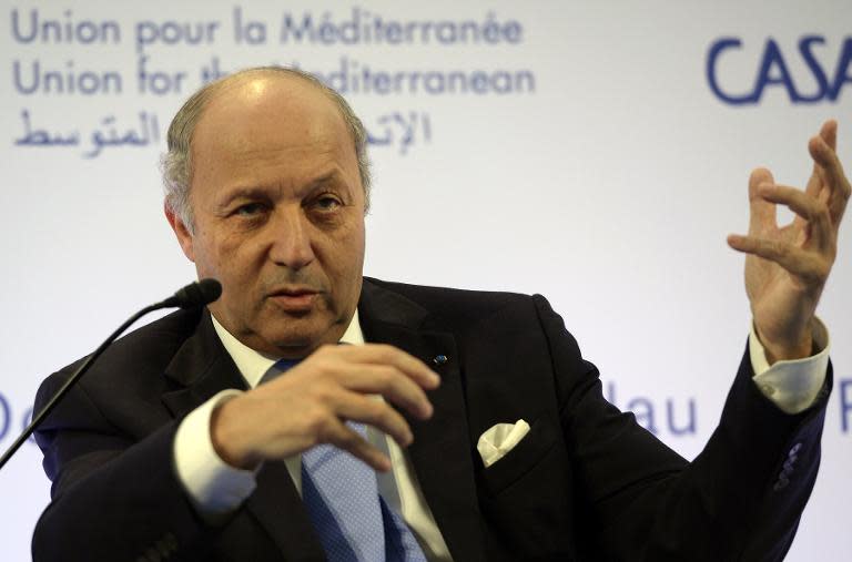 France's Foreign Minister Laurent Fabius speaks during the opening of the first Western Mediterranean Economic Forum on October 23, 2013 at the Union for the Mediterranean headquarters in Barcelona