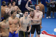 Britain celebrates after winning the mens' 4x200-meter freestyle relay at the 2020 Summer Olympics, Wednesday, July 28, 2021, in Tokyo, Japan. (AP Photo/Charlie Riedel)