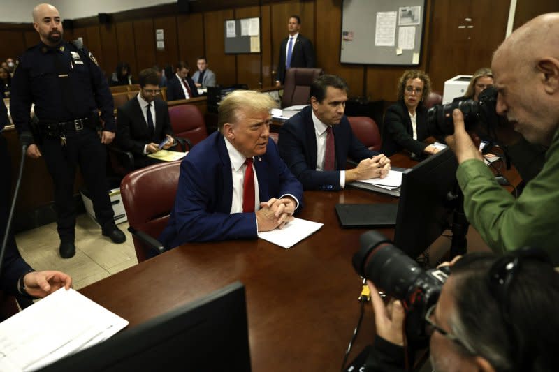 Former President Donald Trump sits in court before his trial at Manhattan criminal court in New York on Monday. Pool Photo by Peter Foley/UPI