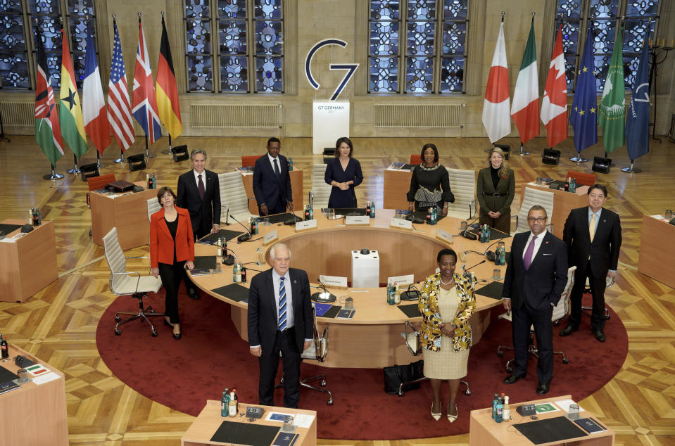 Clockwise from left, the Foreign Minister of France, Catherine Colonna, Secretary of State of the United States, Antony Blinken, the Foreign Minister of the Republic of Ghana, Alfred Mutua, German Foreign Minister Annalena Baerbock, the Foreign Minister of the Republic of Ghana, Shirley Ayorkor Botchwey, Canadian Foreign Minister Melanie Joly, Japan's Foreign Minister Yoshimasa Hayashi, the Foreign Minister of Great Britain, James Cleverly, the Vice Chair of the African Union Commission, Monique Nsanzabaganwa and the EU Representative for Foreign Affairs, Josep Borrell, pose for a photo at the Historic Town Hall during the G7 Foreign Ministers Meeting in Muenster, Germany, Friday, Nov. 4, 2022. (Bernd Lauter/Pool Photo via AP)