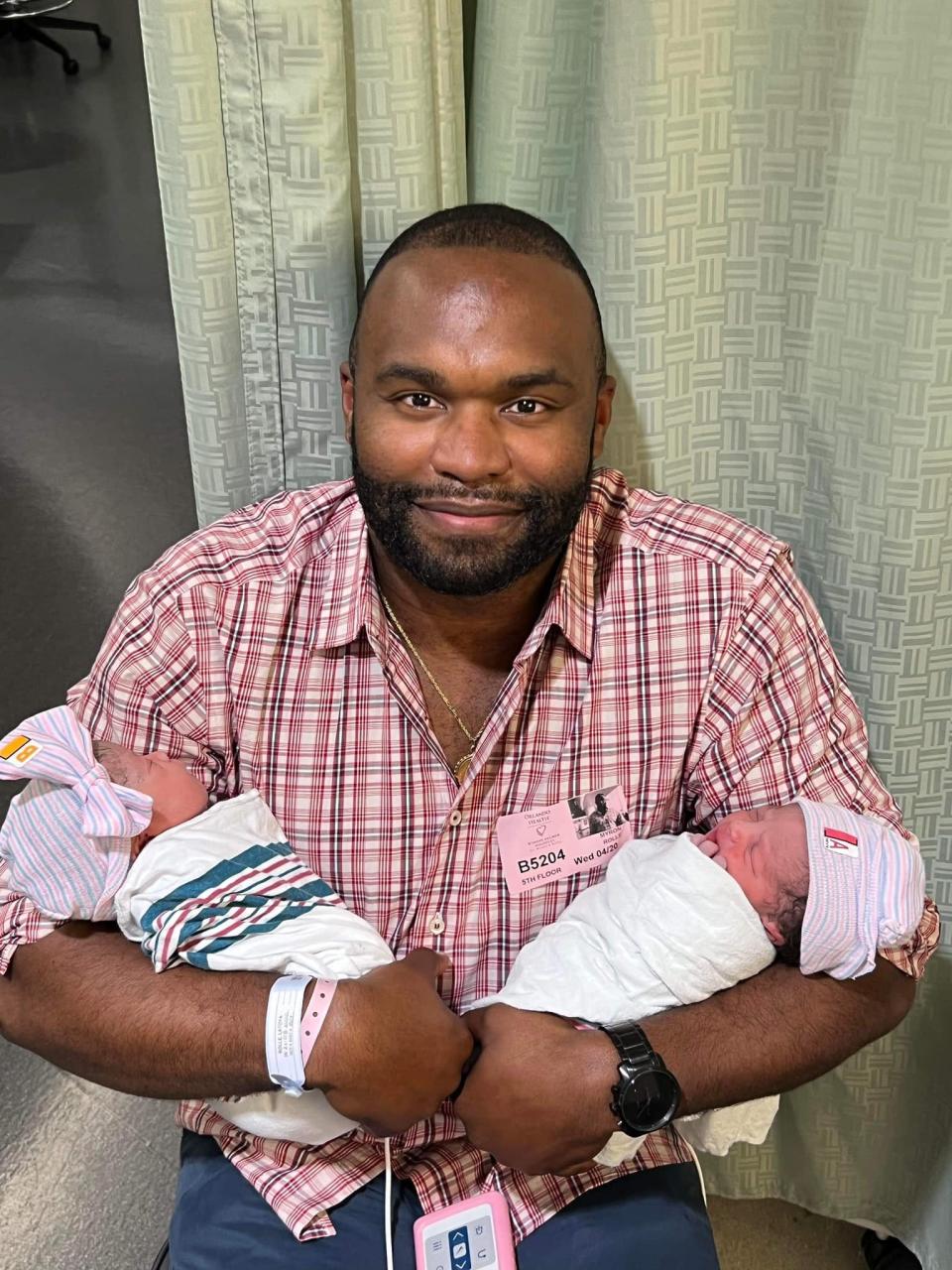 Myron Rolle with his newborn twins.