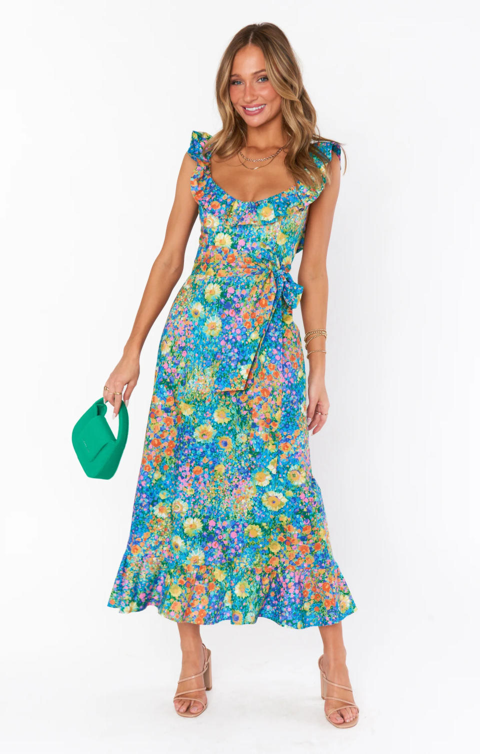 Woman wears floral print Alexis Midi Dress Show Me Your Mumu.