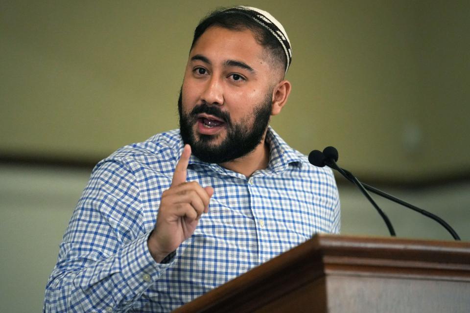 Eddie Chavez Calderon, a campaign organizer for Arizona Jews for Justice, speaks to attendees during the news conference at First Church UCC in downtown Phoenix on Aug. 4, 2022.