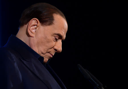 FILE PHOTO: Italy's former Prime Minister Silvio Berlusconi gestures as he speaks during a pre-election gathering in Milan, Italy February 25, 2018. REUTERS/Massimo Pinca/File Photo