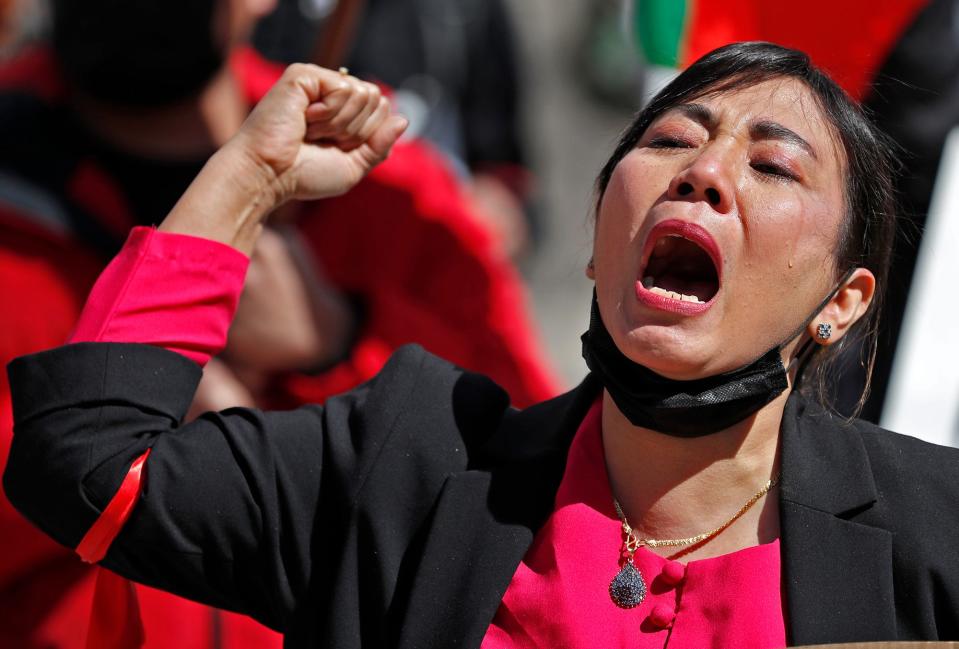 Tha Zin Ooo Kayaw, with tears, yells chants as she and other protesters gather to protest the military coup in Myanmar, Saturday, March 20, 2021 on Monument Circle in Indianapolis. 