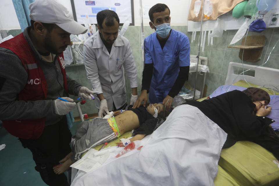 Palestinians wounded in the Israeli bombardment of the Gaza Strip are brought to a hospital in Rafah, Monday, Dec. 11, 2023. (AP Photo/Hatem Ali)